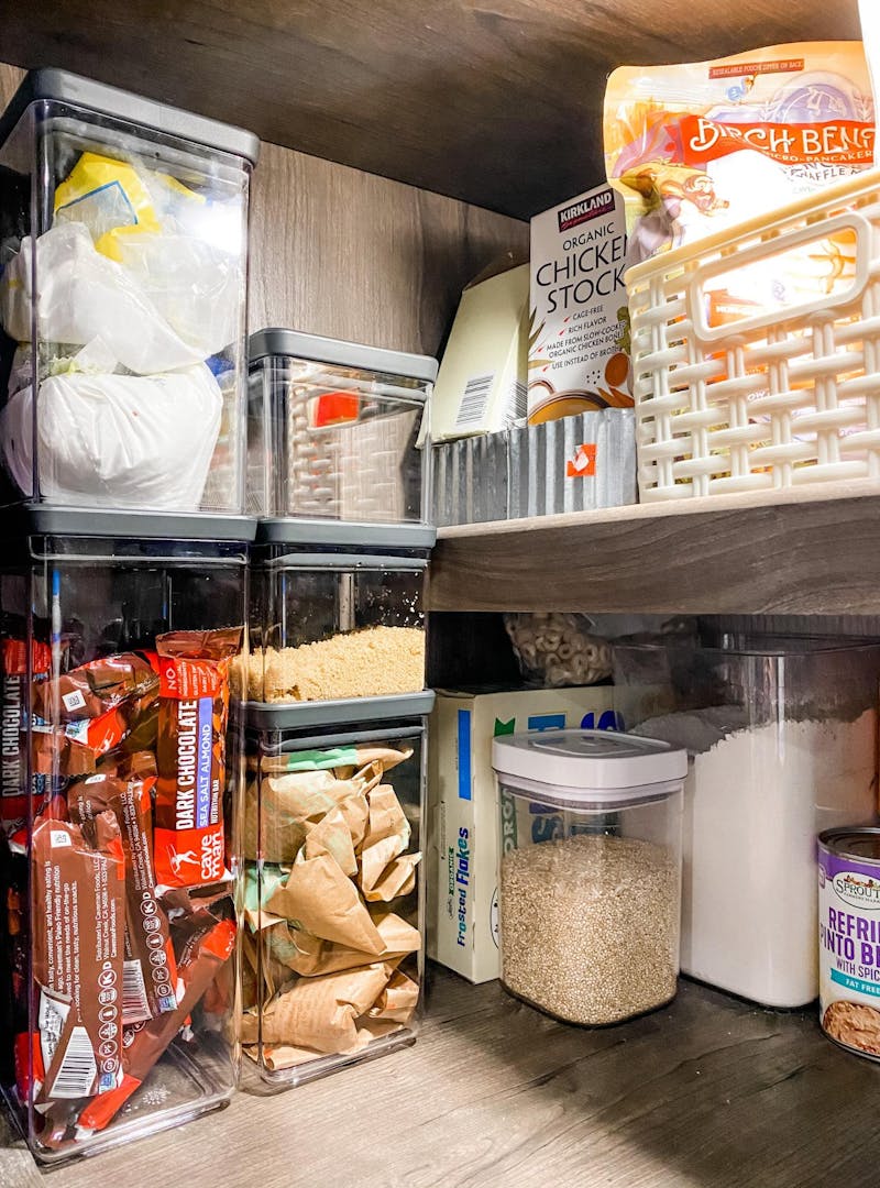 Clear canisters in Brittnee Proha's pantry helping to keep snacks and dry goods organized inside her Heartland Cyclone.