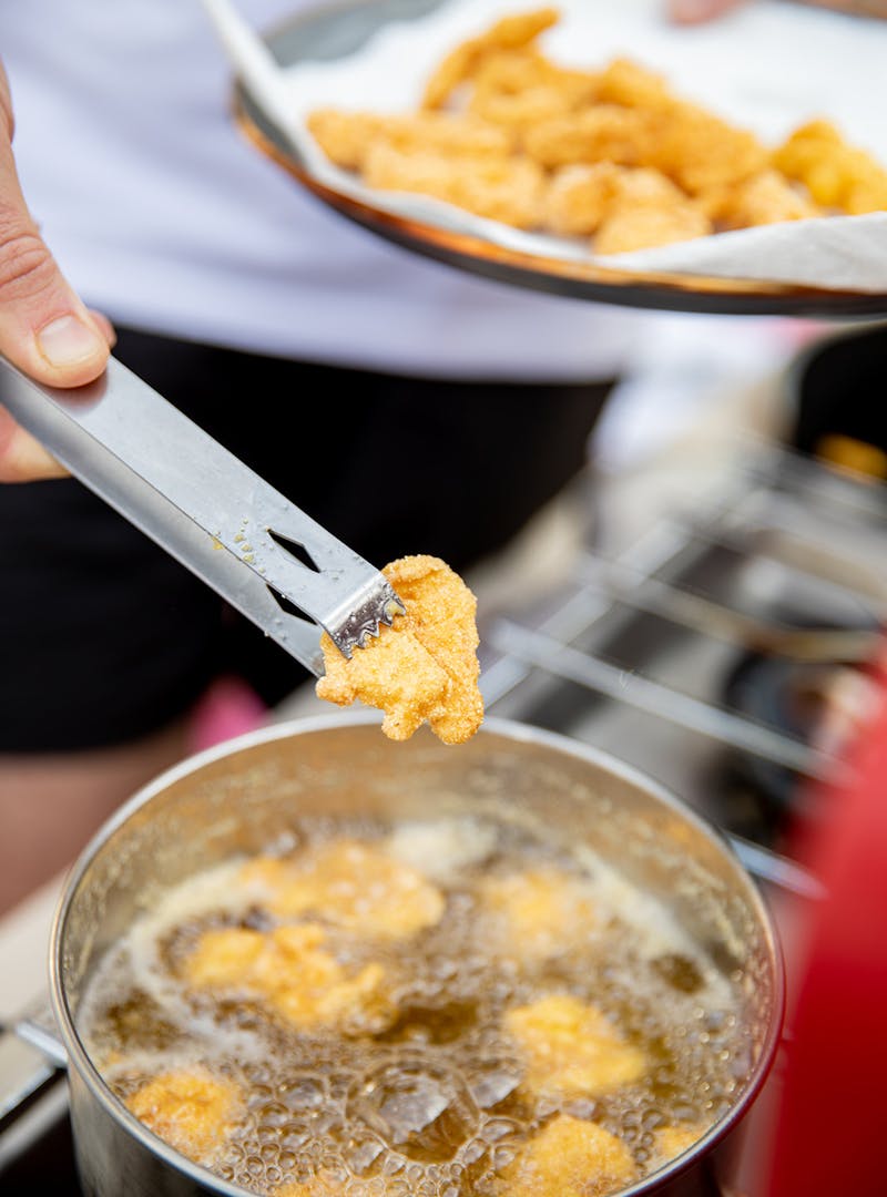 Frying shrimp in hot oil.