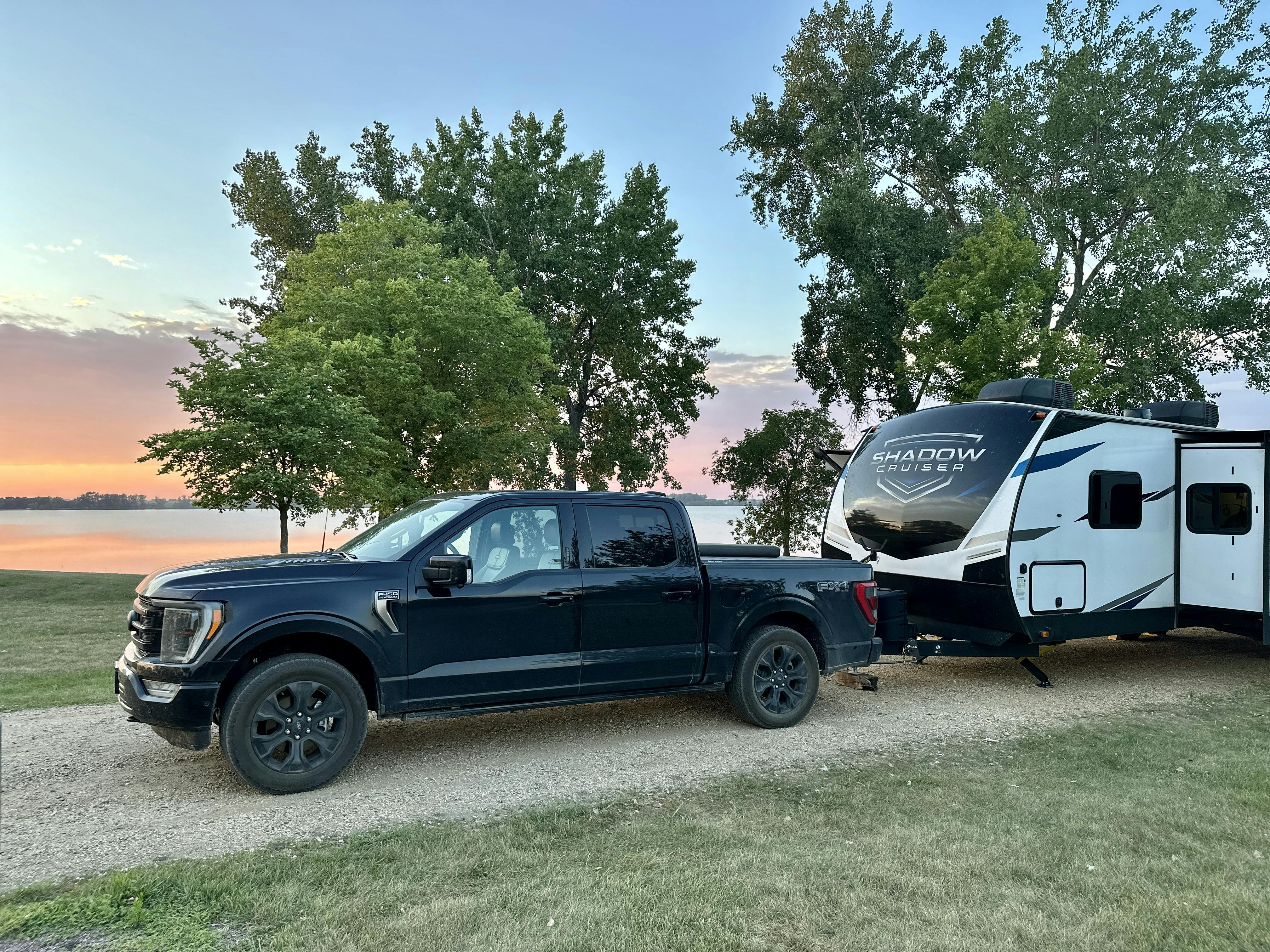 John King's truck and Shadow Cruiser parked at a campground at sunset.