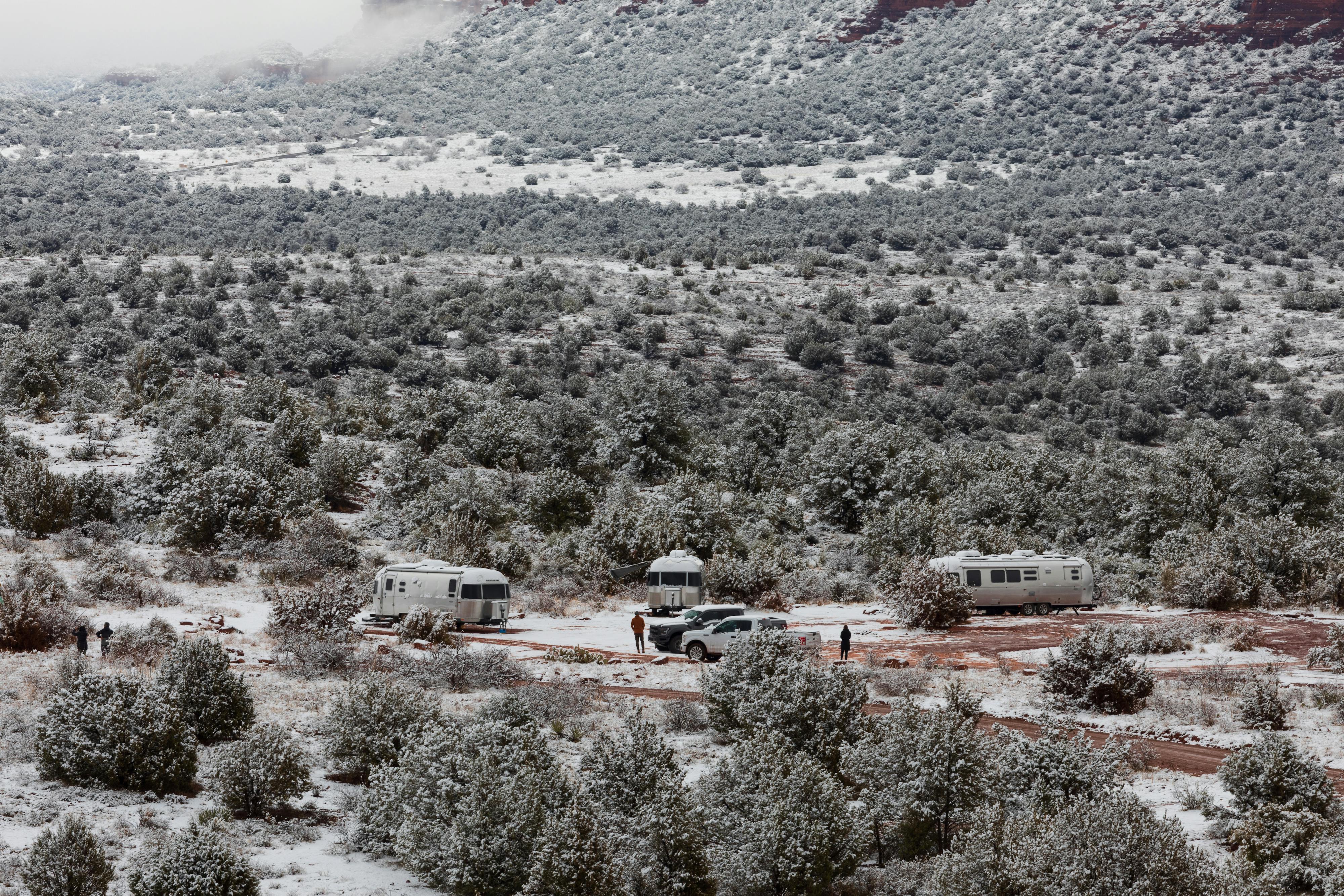 Karen Blue's Airstream camping with other Airstreamers in a snowy desert