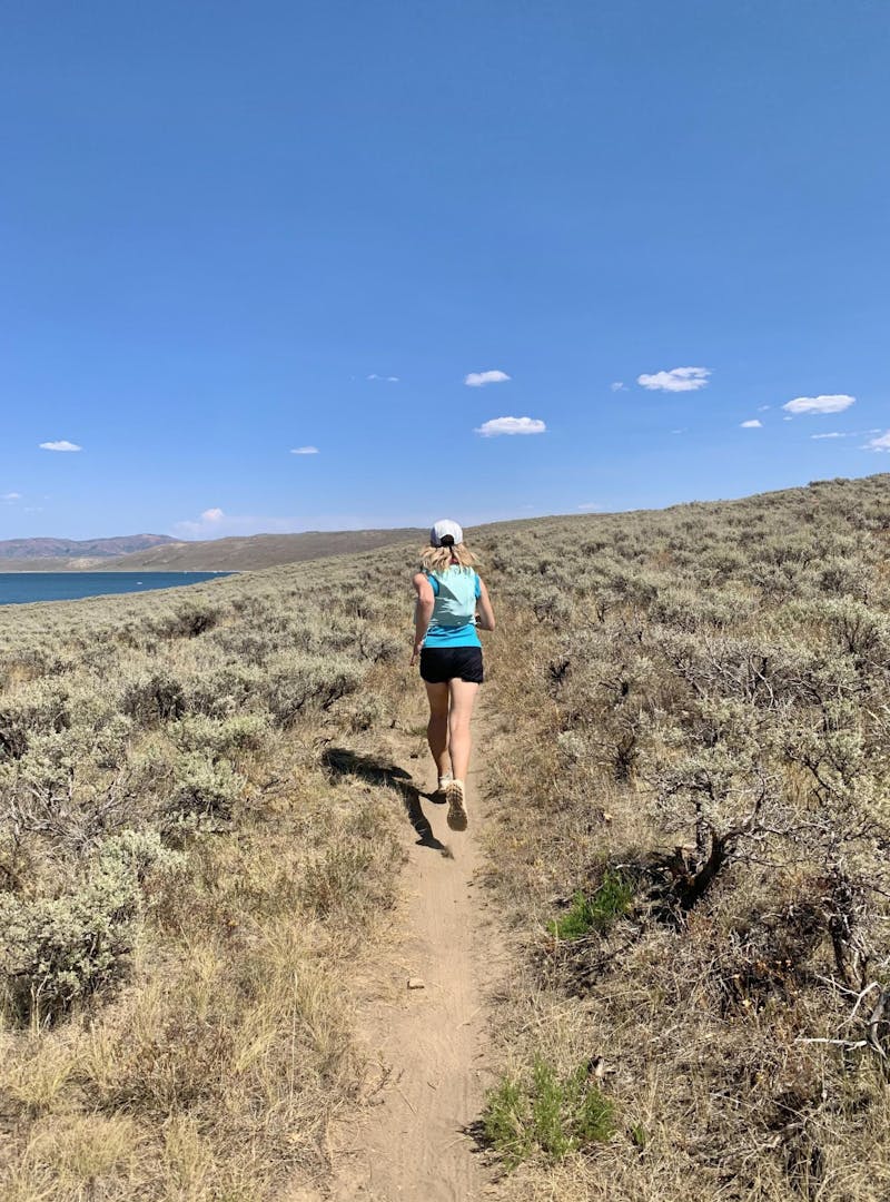 A woman trail running near Spanish Fork, Utah.