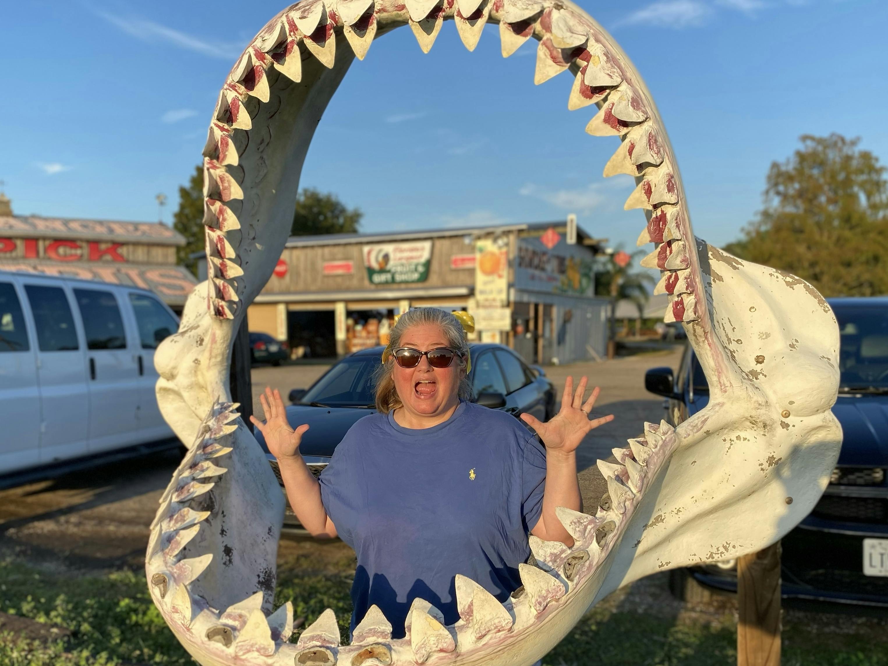 Tiffany Dunagan inside the jaws of a shark replica at a roadside attraction