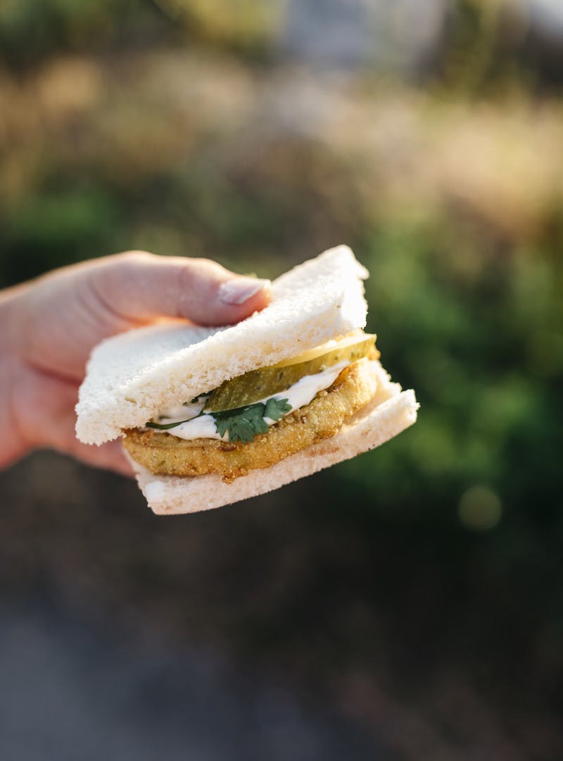 Close up shot of New England fried eggplant slider.