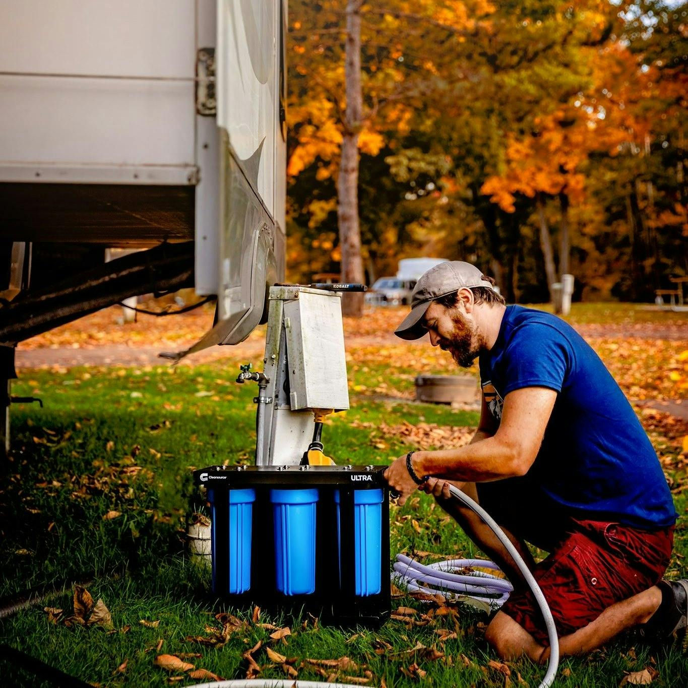 Josh Bailey setting up a water filter on his RV
