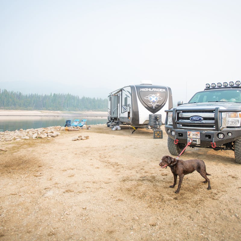 Nate Day's dog on a leash next to an RV and truck.