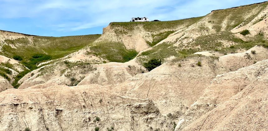 GIANCARLO DAMIANI AND ERIK LEAZURE's RV on top of a valley