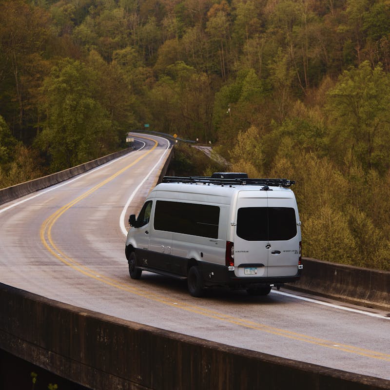 Kathy Karlo driving an Airstream camper van
