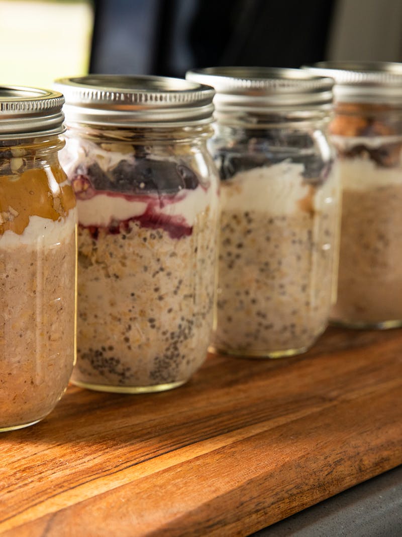 Four mason jars full of overnight oats. 