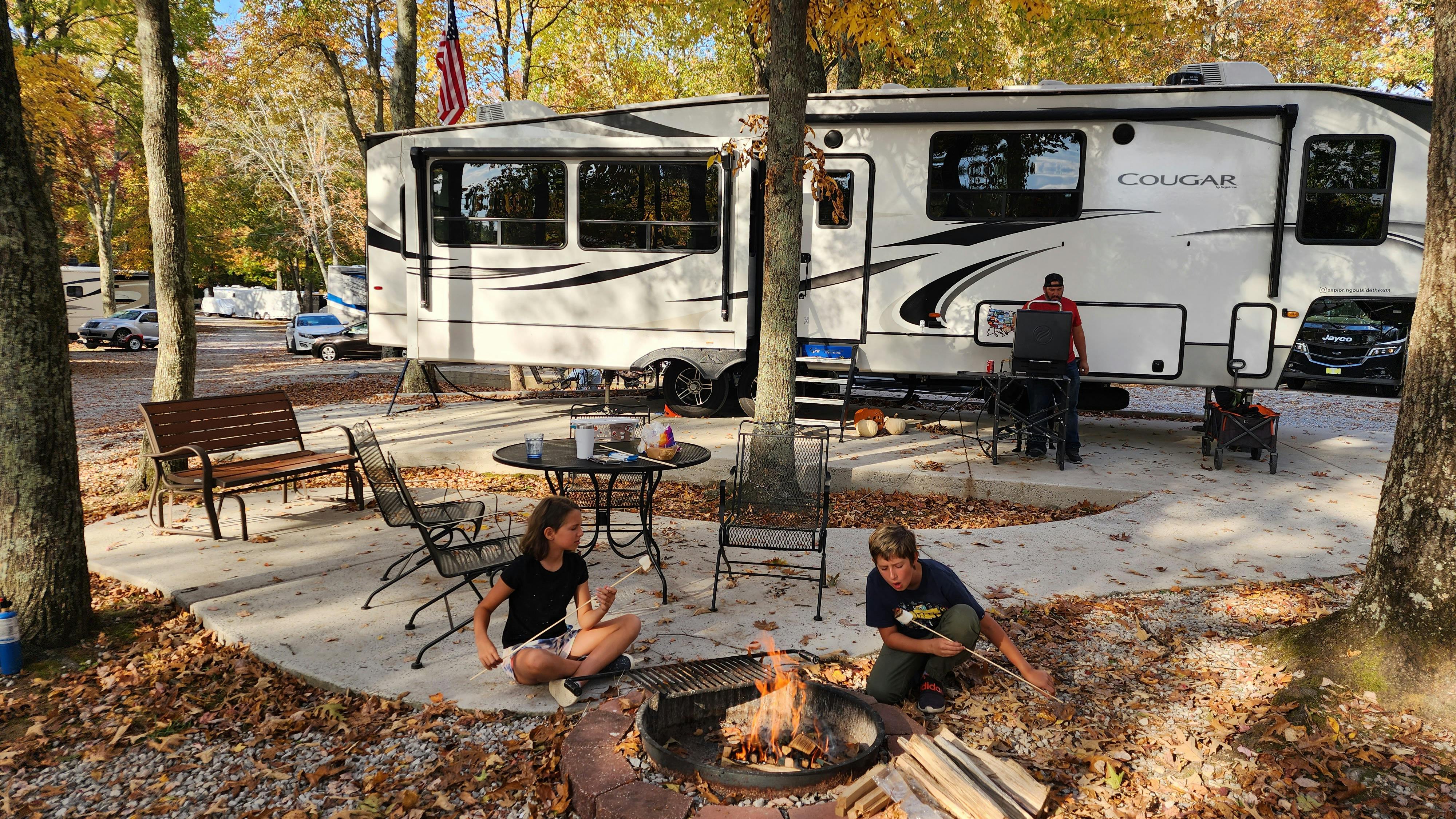 The Techau family in front of their Keystone Cougar Fifth Wheel