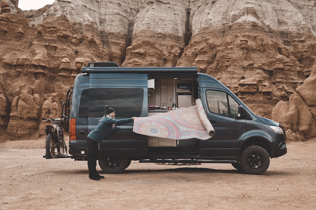 2022 Thor Sanctuary Sprinter Van Lifestyle Kalen Thorien Utah Corporate photo shoot setting up camp first time camping rug