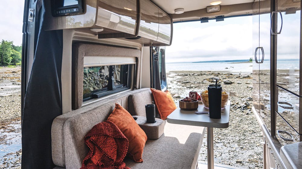 2022 Thor Scope Class B RV Camper Van Lifestyle Maine Corporate photo shoot windows open inside and looking out at ocean slider size