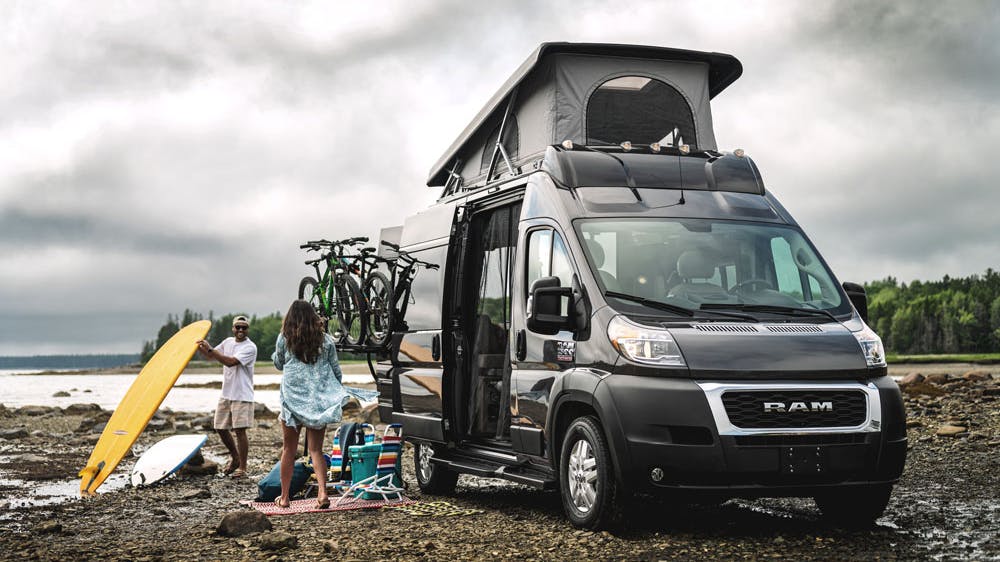 2022 Thor Scope Class B RV Camper Van Lifestyle Maine Corporate photo shoot parked at campsite SkyBunk® Sky Bunk Pop top extended