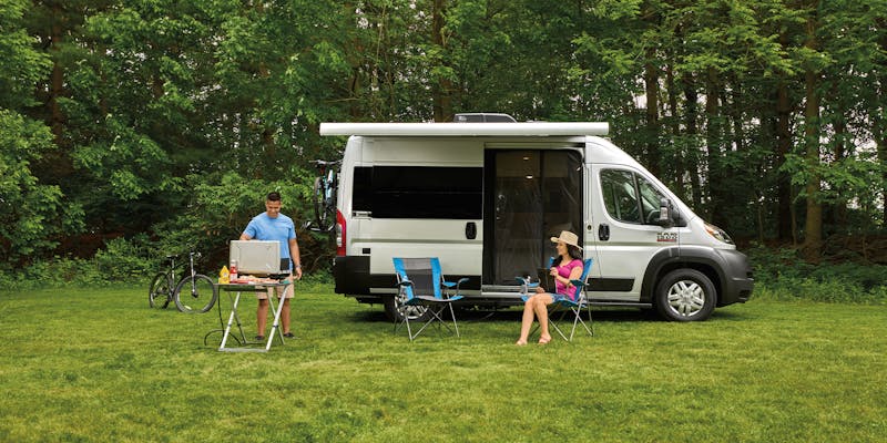 2022 Thor Rize Class B Camper Van Lifestyle grilling photo wide shot Owners Guide header photo