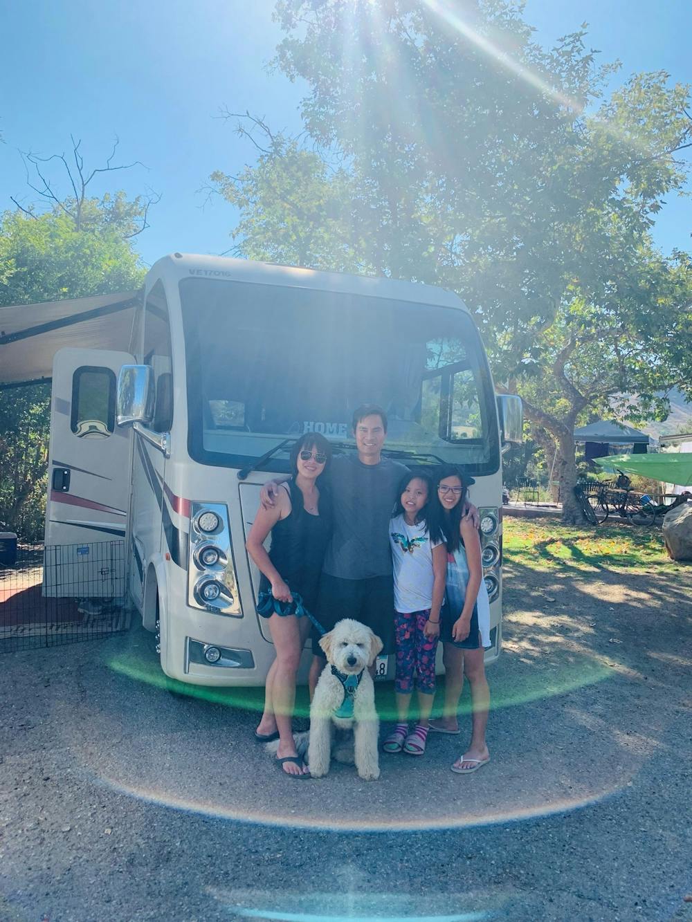 Blog RV Asian Family - family portrait in front of Thor Vegas Class A RV