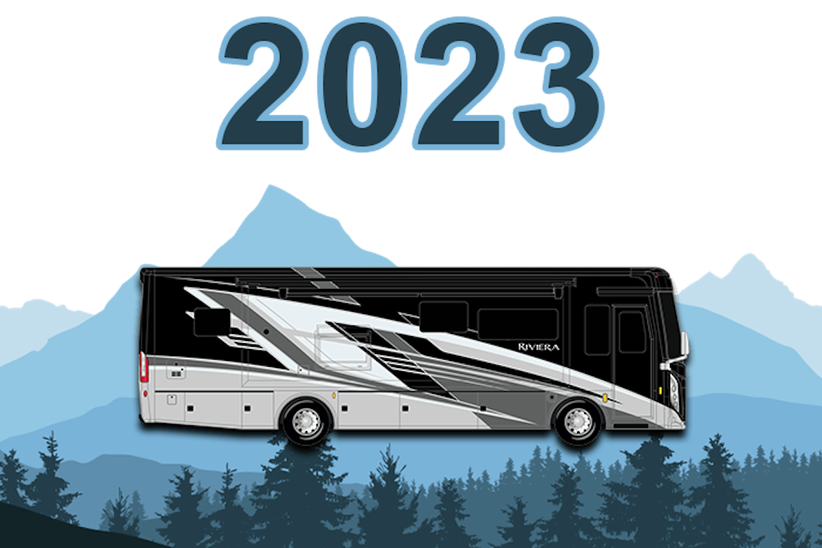 2023 Riviera cloud cover exterior surrounded by blue mountains and trees