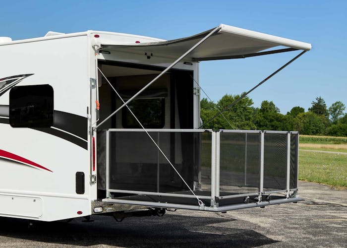 2022 Thor Outlaw Class C Toy Hauler Drop down ramp door with railings for patio use and manual awning key feature toy hauler garage
