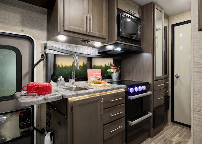 Outlaw Class C Black talon with weathered cherry cabinetry kitchen