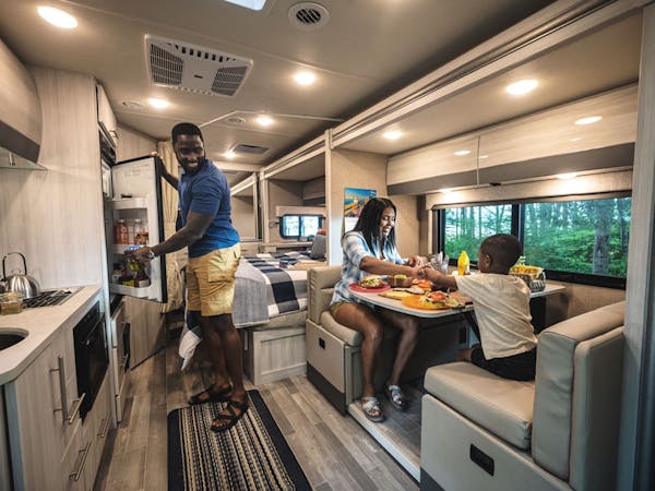 2022 Thor Gemini AWD Class B+ RV Lifestyle Maine Corporate Photo Shoot family eating at dinette