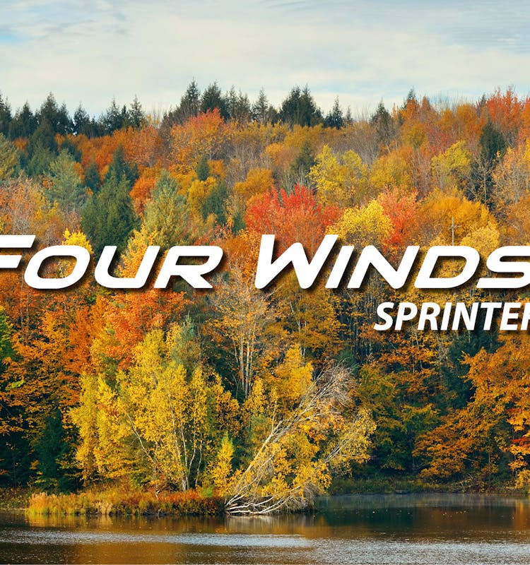 Four Winds Sprinter with view of lake and colorful trees