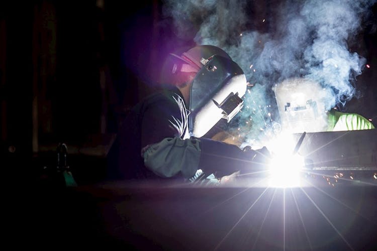 A Thor Motor Coach factory worker welding