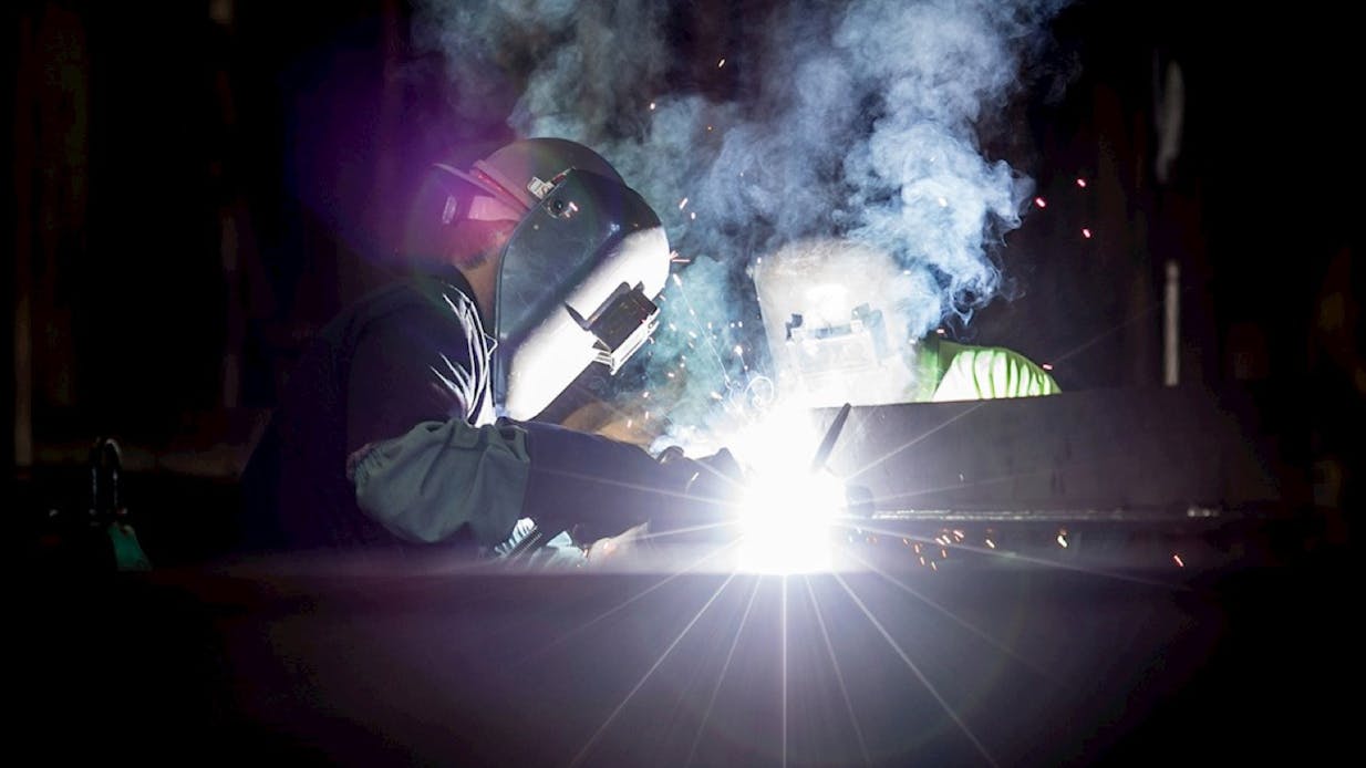 A factory worker welding