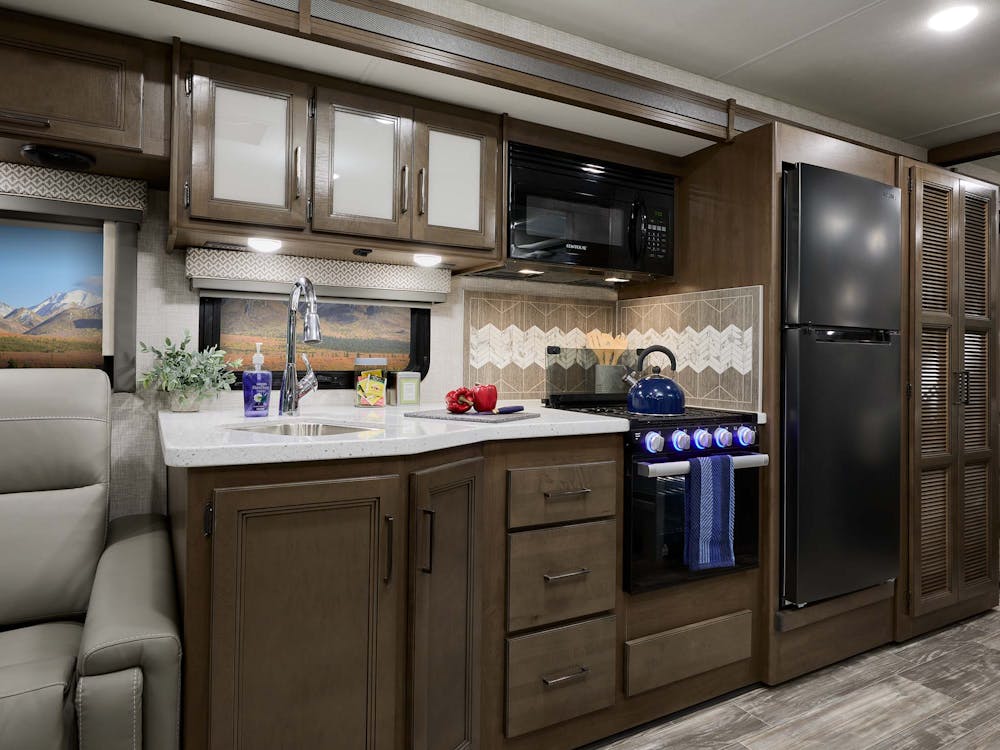 2022 Thor Hurricane Class A RV Kitchen - Silver Strand Carolina Cherry Cabinetry