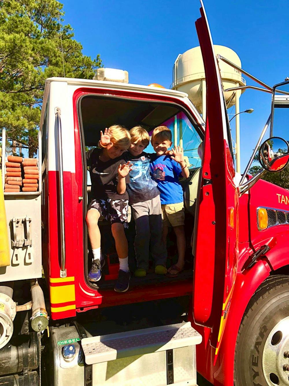 Blog photo 5 Tips for Making and Keeping Friends on the Road - Lou exploring truck with friends