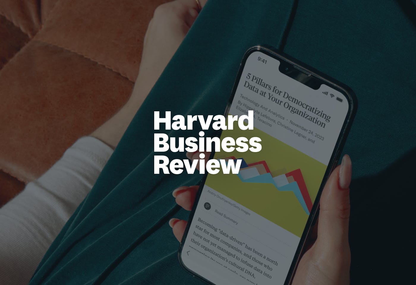 HBR logo in front of an image of a person holding a phone with the HBR mobile app.