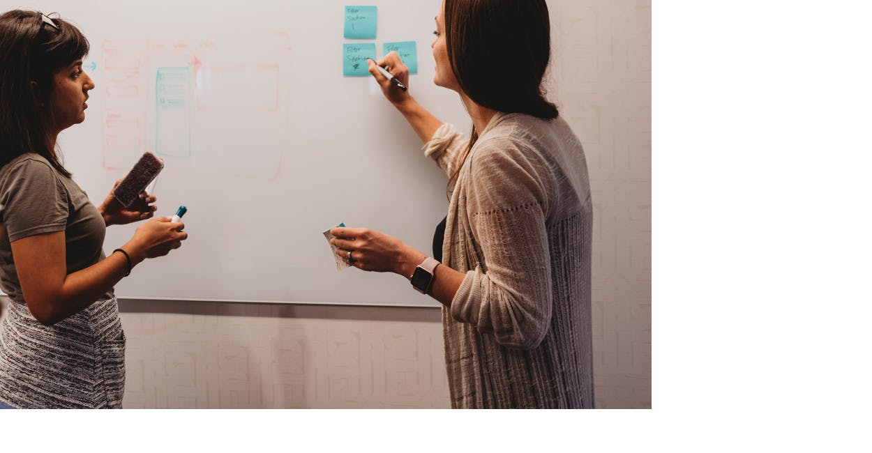 2 people collaborating during a design sprint