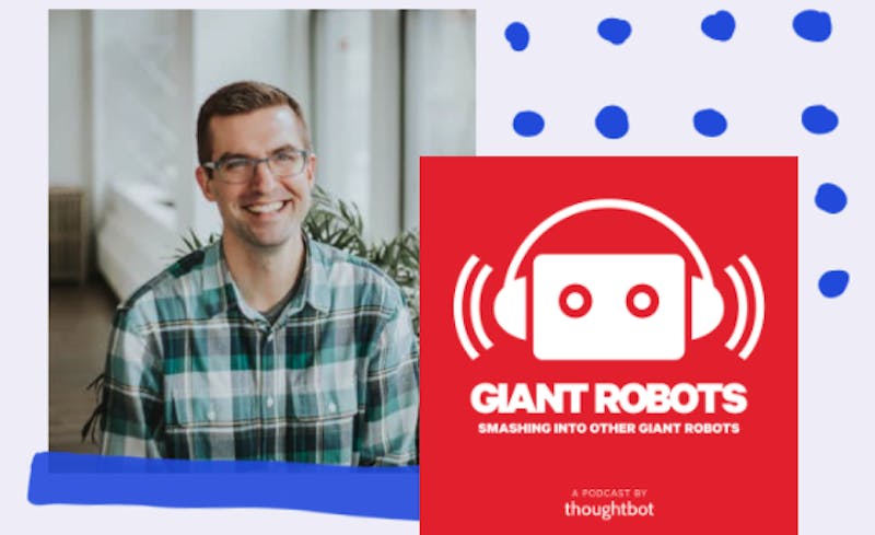 founder and CEO Chad Pytel smiling happily beside the logo for the Giant Robots podcast