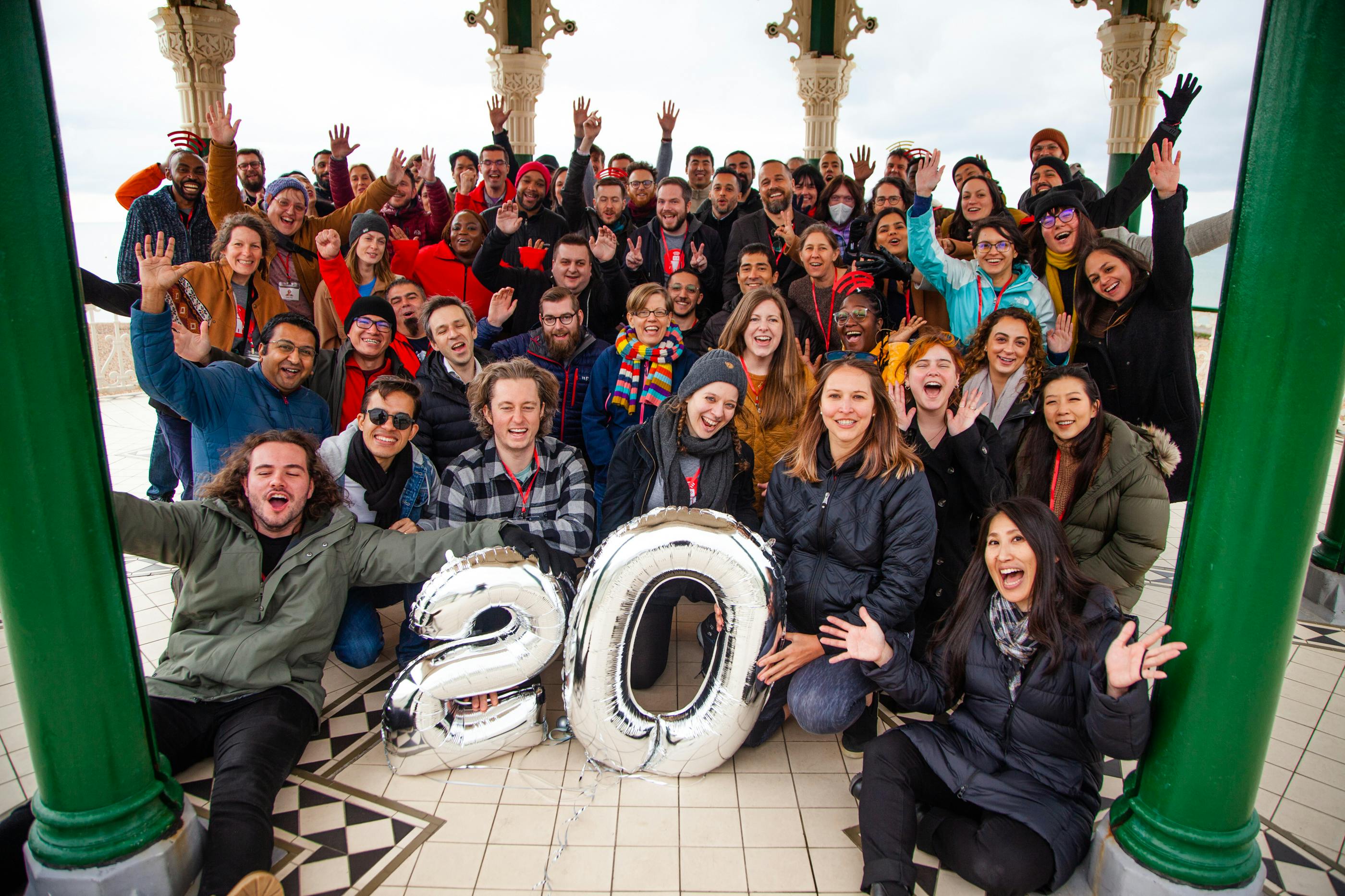 The thoughtbot team with 20th anniversary balloons.