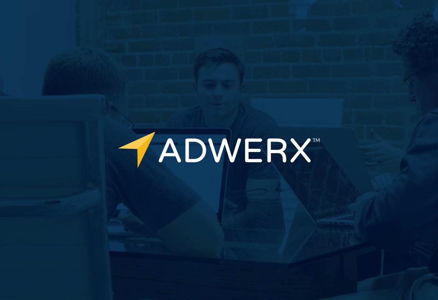 The Adwerx logo on a dark background with a photo of people sitting at a conference room table behind the logo.