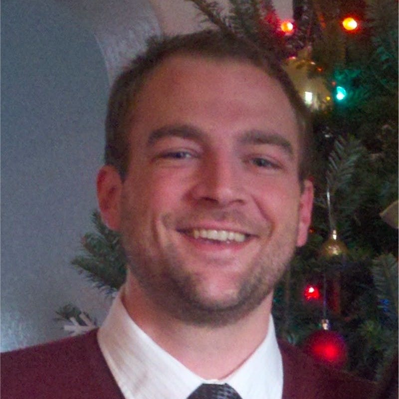 A headshot of Michael St. Mars