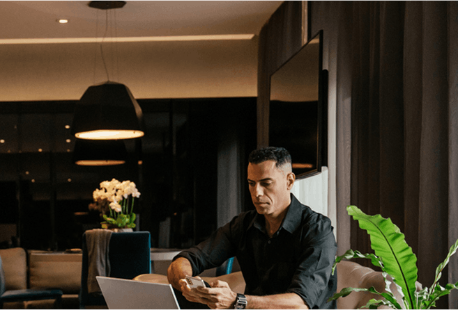 Photo of businessperson working in hotel room