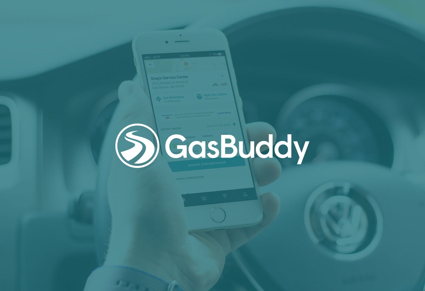 The GasBuddy logo on a dark teal background with a photo of someone holding a phone in front of a car steering wheel.