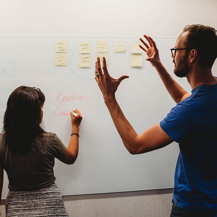 Woking on building the right product at a whiteboard