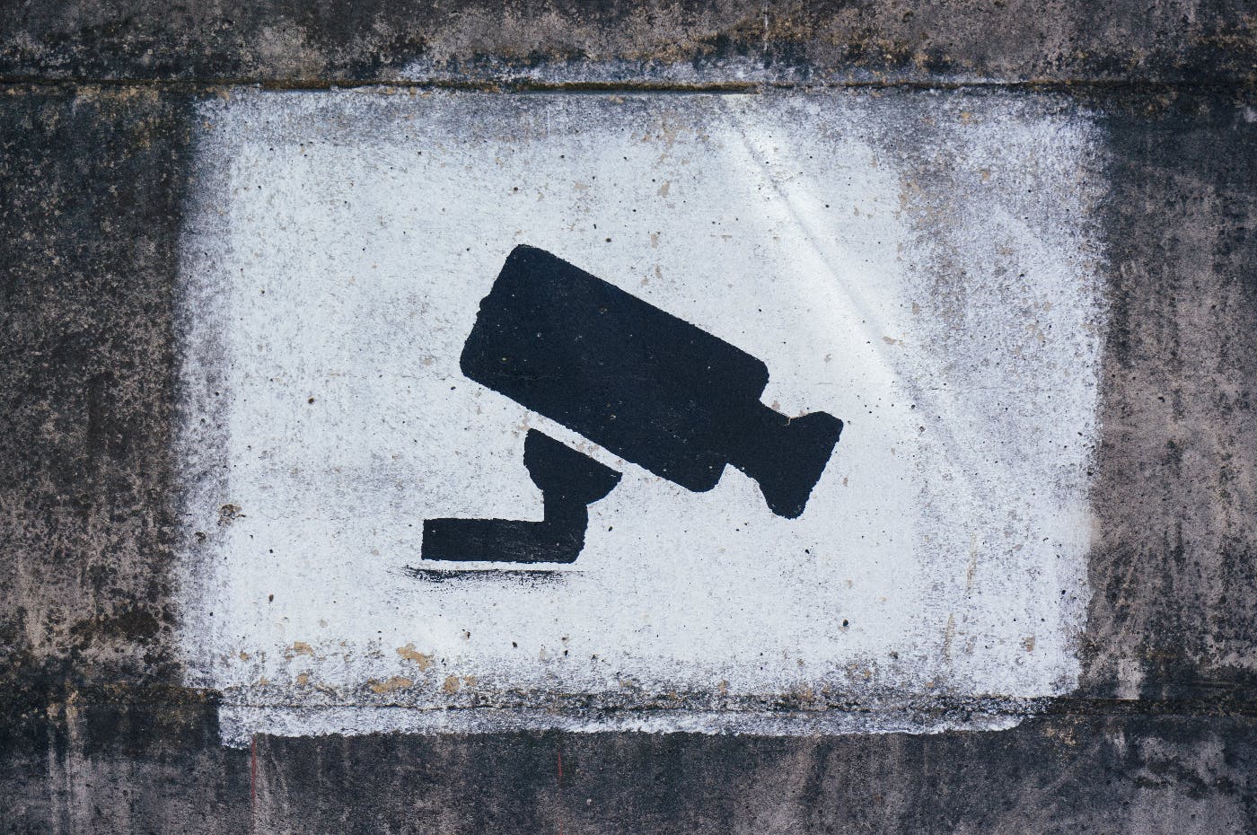 A stencil on a wall of a video camera 