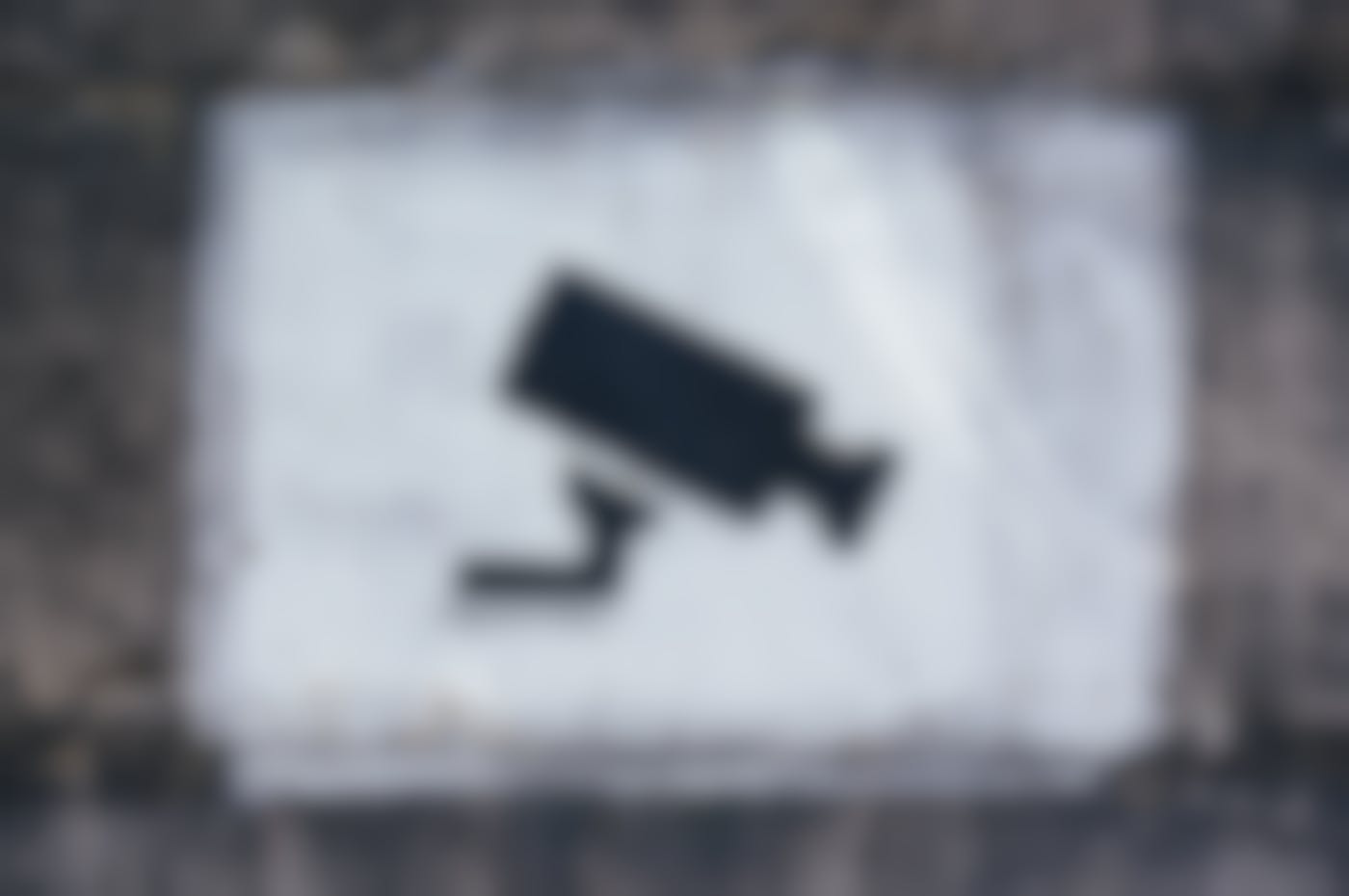 A stencil on a wall of a video camera 
