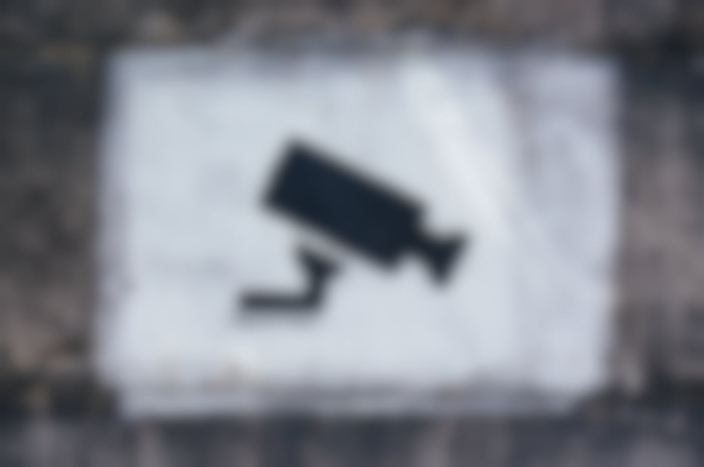 A stencil on a wall of a video camera
