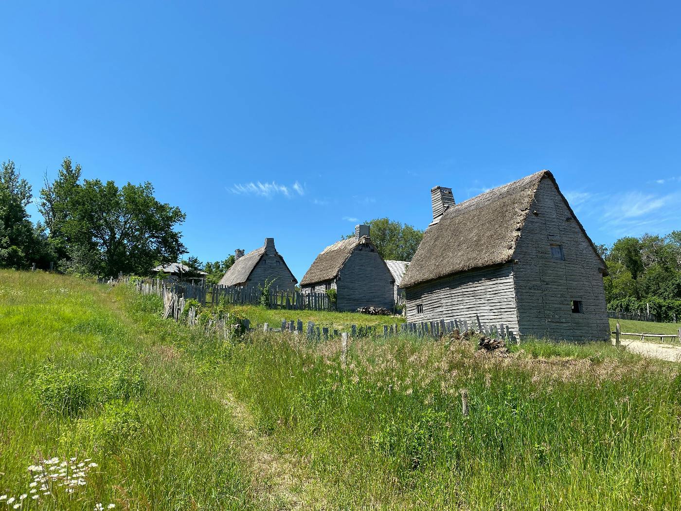 Old wood and thatch houses on Plymouth Plantation.