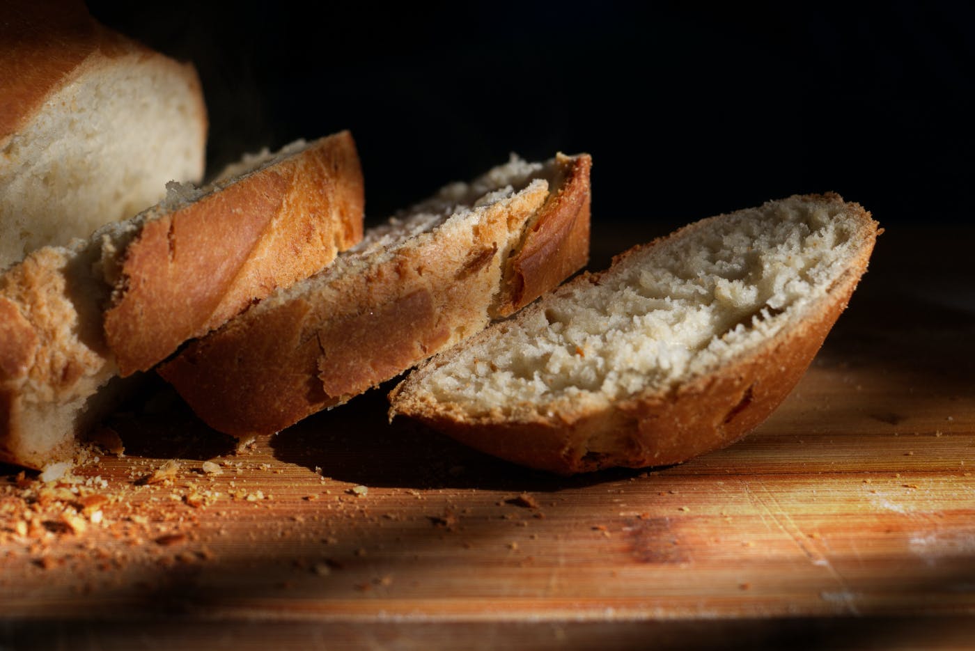 slices of fresh bread on a wood table