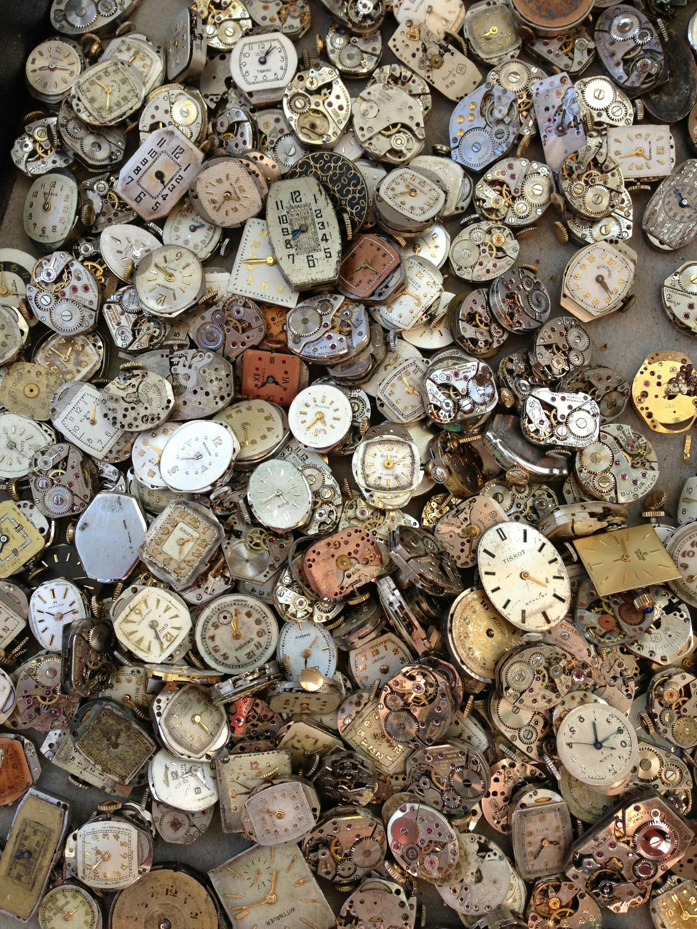 a jumble of  broken time pieces