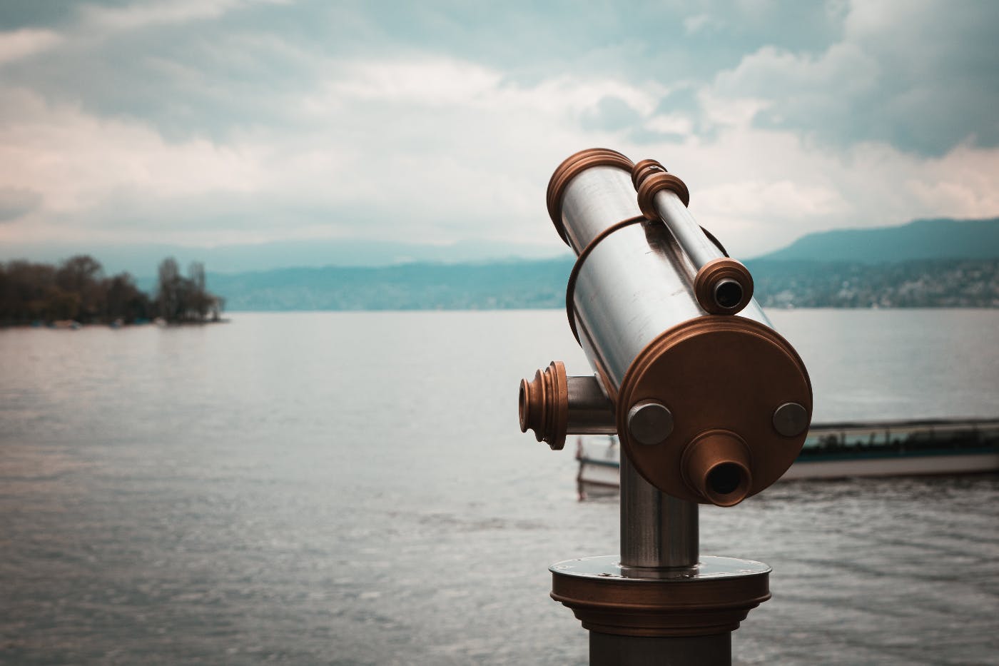 A telescope overlooking a large body of water