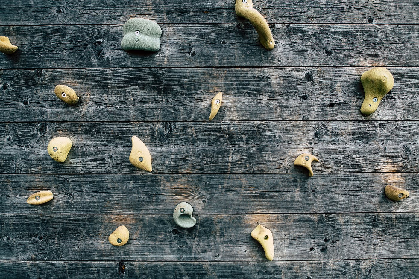 a well worn wood climbing wall