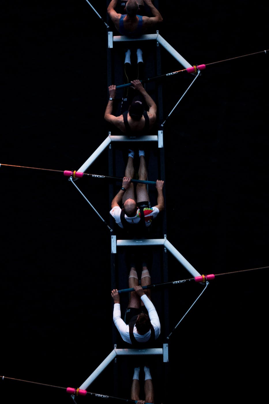 an aerial view of a men's rowing team