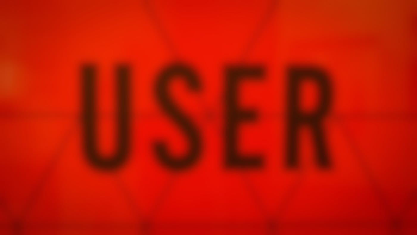The word USER in black against a red background