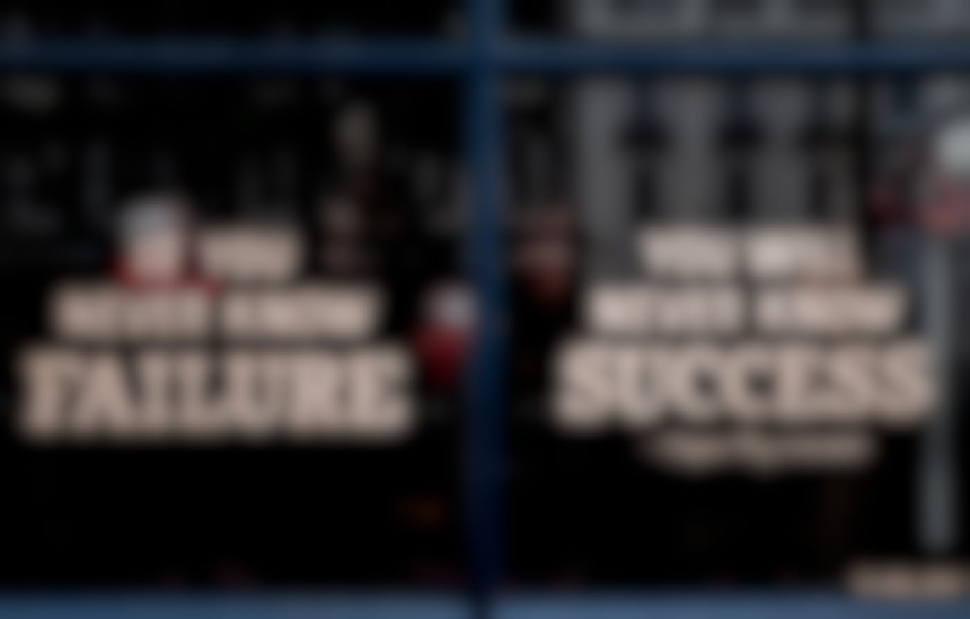 Fromnt windows of a boxing gym with the Sugar Ray Leonard quote: "If you never know failure, you will never know success"