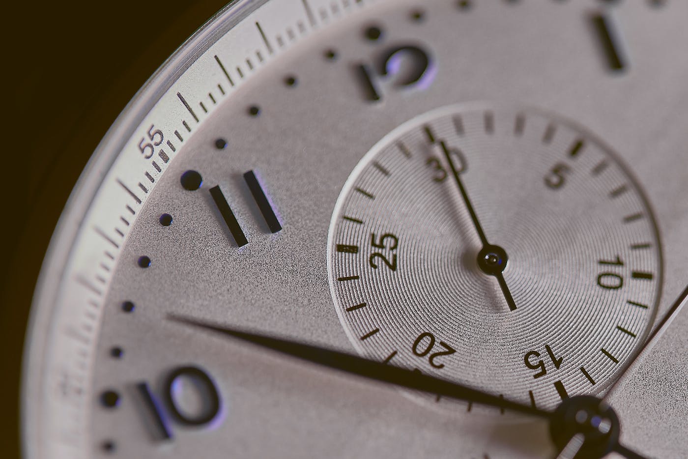 close up of a silver stop watch