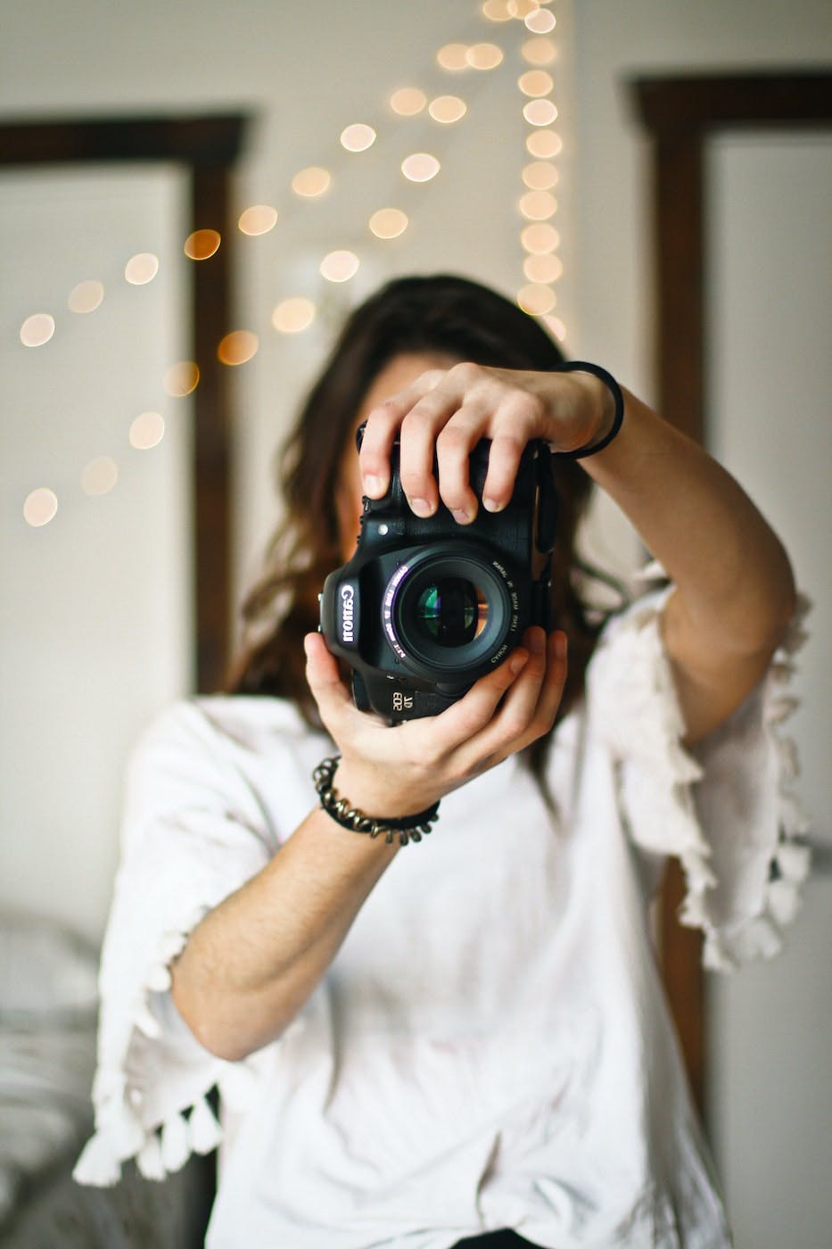 woman holding camera taking photo