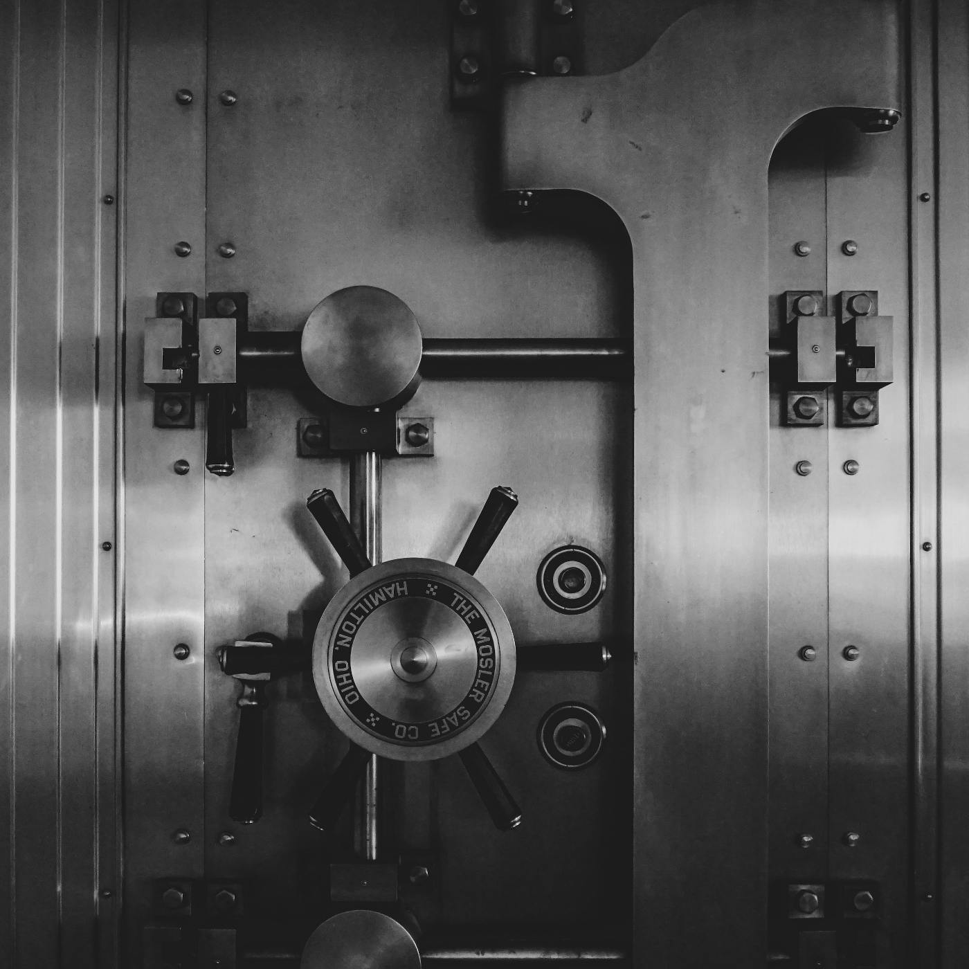 A silver safe with a heavy door